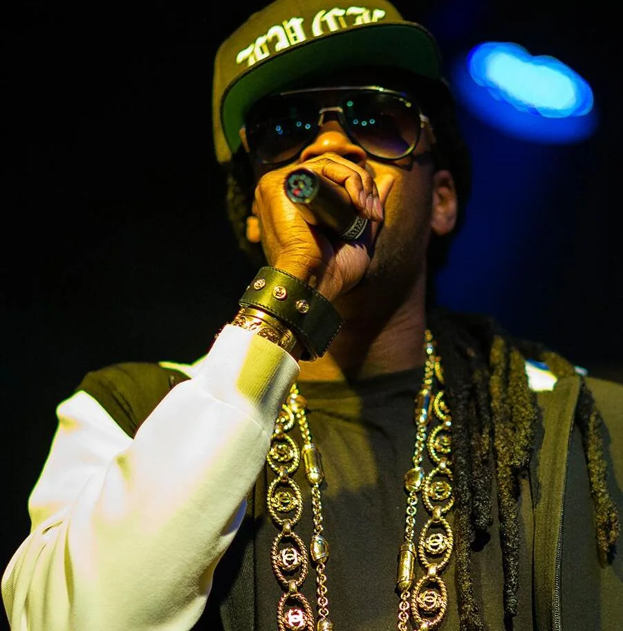 2 Chainz performs with a microphone in Orange County in 2013.