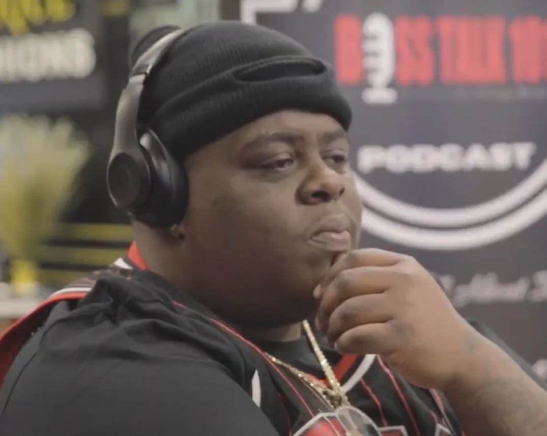 BigXthaPlug wears headphones and a black knit cap during a BOSS TALK 101 interview in 2023.