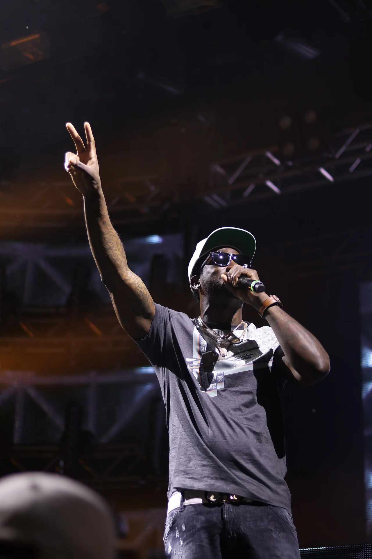 Gucci Mane performs in a black shirt and sunglasses at 515 Alive in 2017.