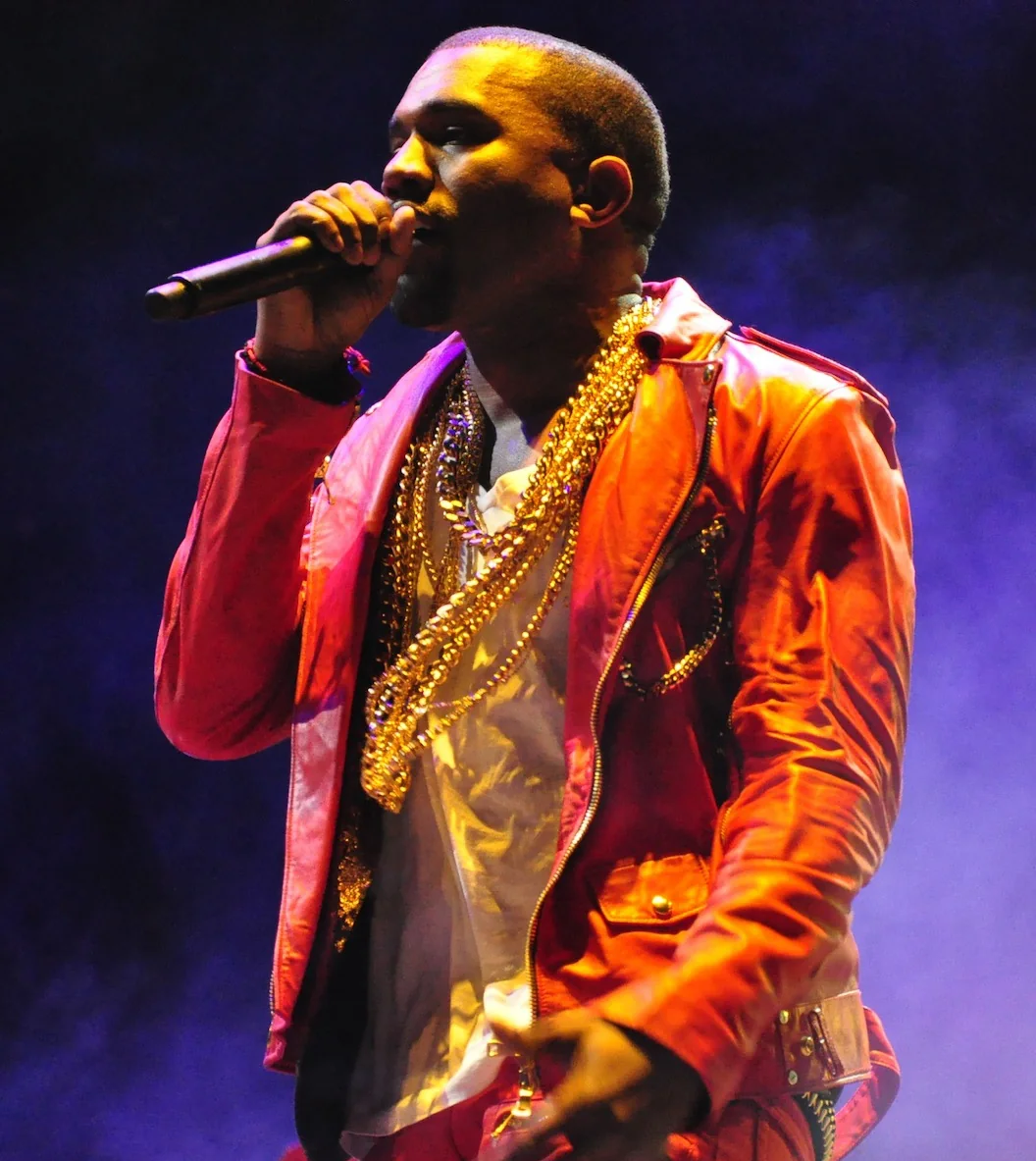 Kanye West performs in a red jacket at Lollapalooza Chile in 2011.
