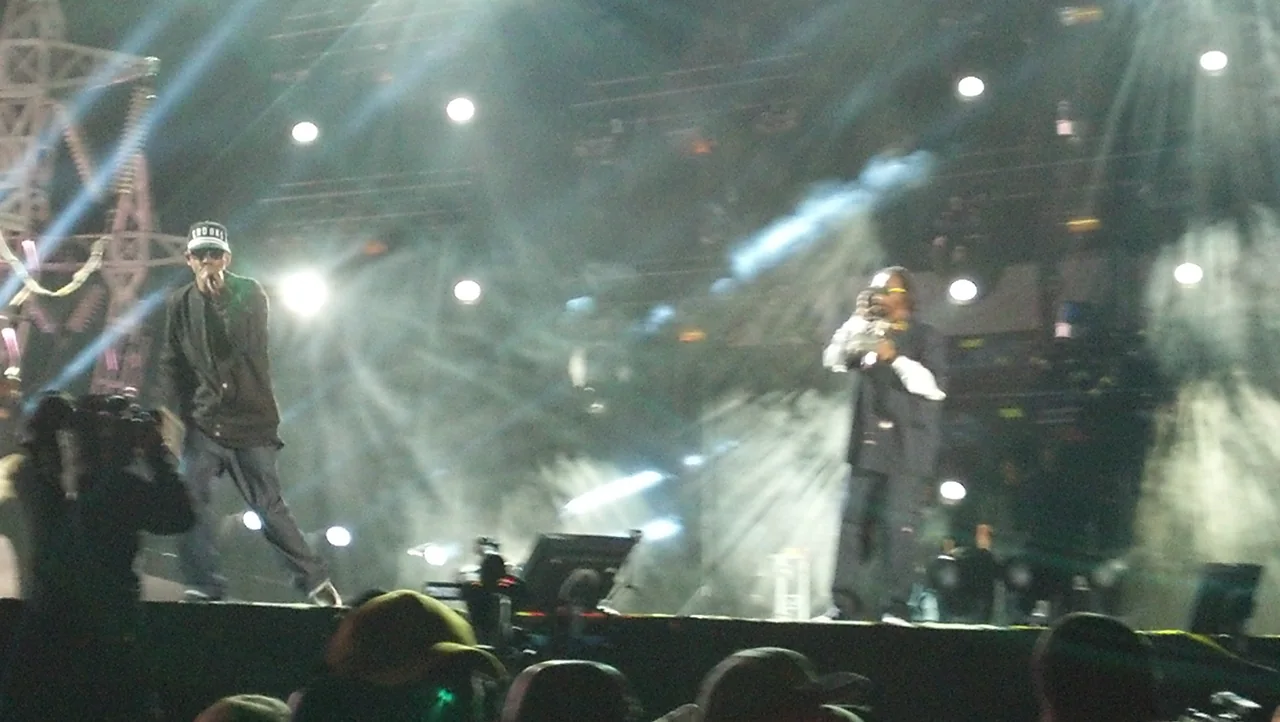 Kurupt and Snoop Dogg stand together onstage at Coachella in 2012.