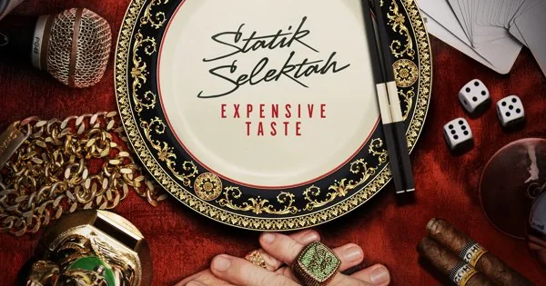 Statik Selektah’s Expensive Taste album artwork: a decorative plate on a red table surrounded by dice, cards and jewelry.