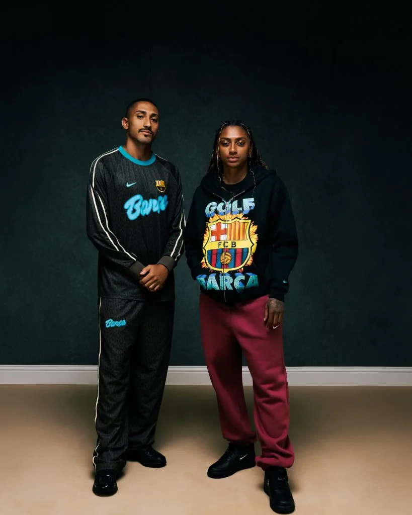 Raphinha and Kerolin pose in black FC Barcelona x GOLF WANG apparel.